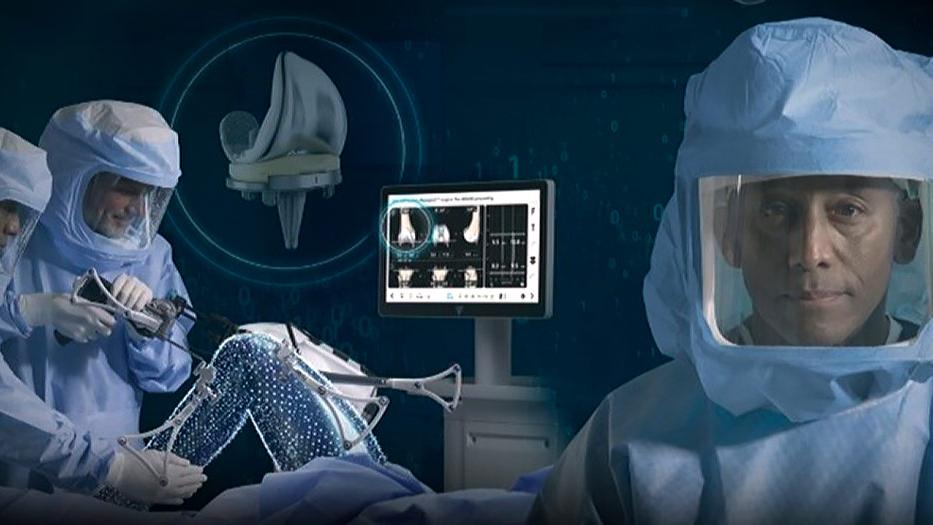 Surgeons using the VELYS™ Robotic-Assisted Solution